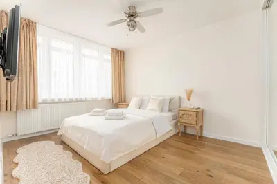 Łóżko lub łóżka w pokoju w obiekcie Jerozolimskie Premium Apartment
