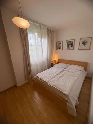 Łóżko lub łóżka w pokoju w obiekcie Murano Apartaments Elektoralna 12A