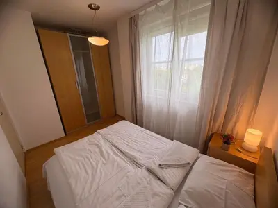 Łóżko lub łóżka w pokoju w obiekcie Murano Apartaments Elektoralna 12A