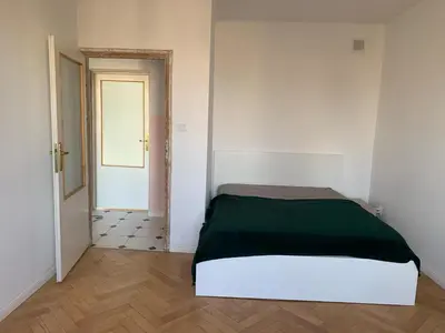 Łóżko lub łóżka w pokoju w obiekcie Dog of Warsaw Apartment - Odolańska