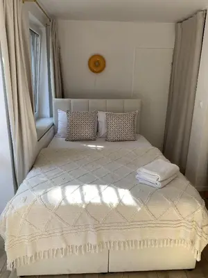 Łóżko lub łóżka w pokoju w obiekcie apartament lulu