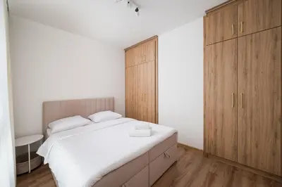 Łóżko lub łóżka w pokoju w obiekcie Włochy Równoległa Cosy Apartment by BookingHost