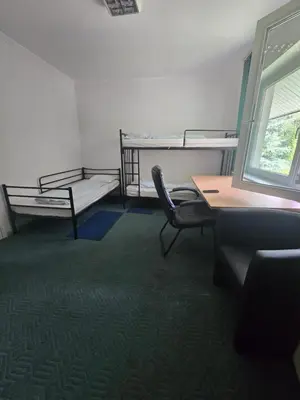 Łóżko lub łóżka w pokoju w obiekcie Hom Wawer