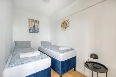 Łóżko lub łóżka w pokoju w obiekcie Labo Apartment Nowolipki Smocza