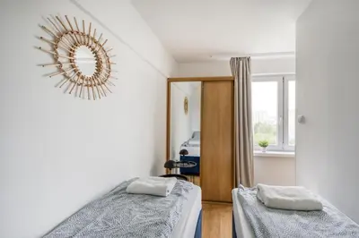 Łóżko lub łóżka w pokoju w obiekcie Labo Apartment Nowolipki Smocza