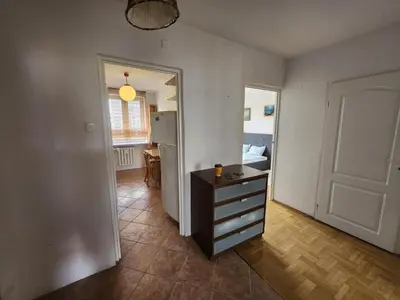 Łóżko lub łóżka w pokoju w obiekcie Metro Bemowo Ratusz - 3 pokoje