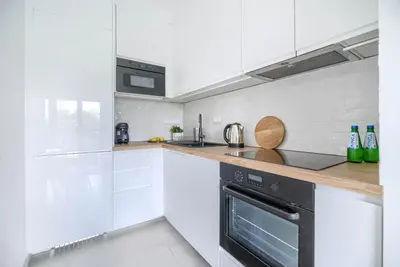 Kuchnia lub aneks kuchenny w obiekcie Family & Business Elegant Apartments Grzybowska 37 Centrum, PARKING, Wi-Fi, Netflix