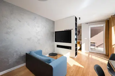 Telewizja i/lub zestaw kina domowego w obiekcie Ursus Deluxe Apartment by BookingHost