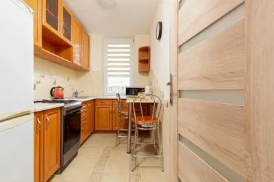 Kuchnia lub aneks kuchenny w obiekcie Spacious Apartment close to PGE Stadium in Warsaw by Noclegi Renters