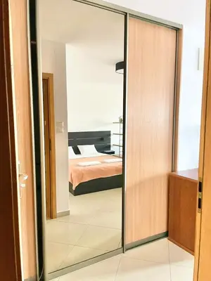 Łóżko lub łóżka w pokoju w obiekcie Suite Loft Apartment