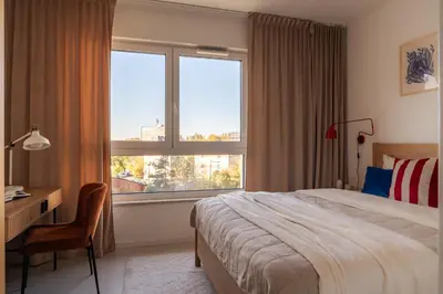 Łóżko lub łóżka w pokoju w obiekcie Malmö Family Apartment by VAYA STAYS
