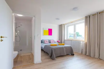 Łóżko lub łóżka w pokoju w obiekcie Green Avenue Apartments B