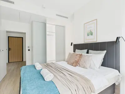 Łóżko lub łóżka w pokoju w obiekcie Prosta 69D SuperApart