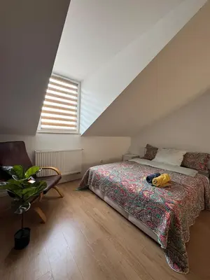 Łóżko lub łóżka w pokoju w obiekcie Cozy Studio Warszawa Praga PGE Stadion
