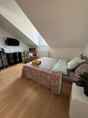 Łóżko lub łóżka w pokoju w obiekcie Cozy Studio Warszawa Praga PGE Stadion