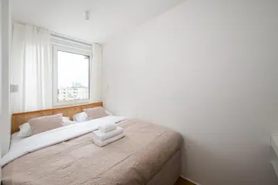Łóżko lub łóżka w pokoju w obiekcie Solec Powiśle Deluxe Apartment by BookingHost