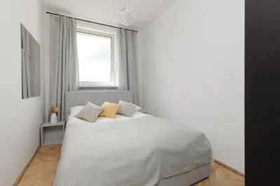 Łóżko lub łóżka w pokoju w obiekcie Family Apartment near Old Town by Noclegi Renters