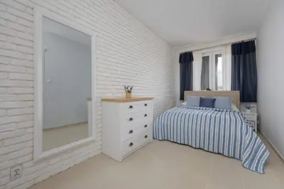 Łóżko lub łóżka w pokoju w obiekcie Spacious Apartment for 4 People with Air Conditioning by Noclegi Renters