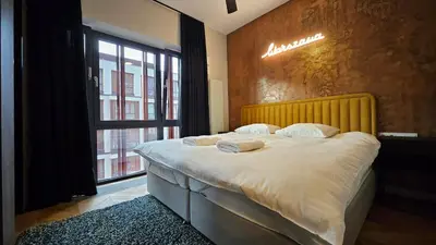 Łóżko lub łóżka w pokoju w obiekcie VipWarsawApartments pl Browary Warszawskie