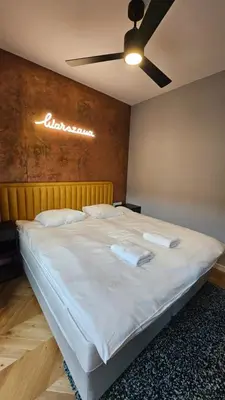 Łóżko lub łóżka w pokoju w obiekcie VipWarsawApartments pl Browary Warszawskie