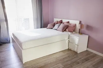 Łóżko lub łóżka w pokoju w obiekcie Lila apartament