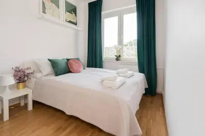 Łóżko lub łóżka w pokoju w obiekcie Comfort & City Aleja Solidarnosci