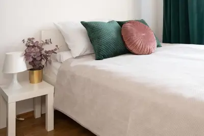 Łóżko lub łóżka w pokoju w obiekcie Comfort & City Aleja Solidarnosci