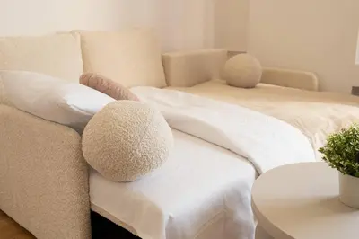Łóżko lub łóżka w pokoju w obiekcie Comfort & City Aleja Solidarnosci