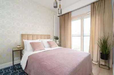 Łóżko lub łóżka w pokoju w obiekcie Golden Apartments- Mennica Residence, 1-Bedroom in City Center #65