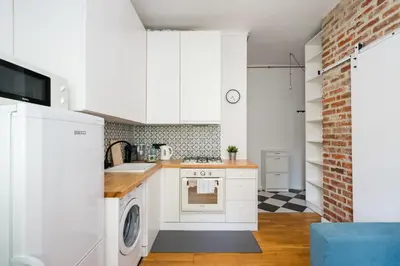 Kuchnia lub aneks kuchenny w obiekcie Metro Racławicka Comfy Apartment by BookingHost