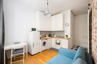Kuchnia lub aneks kuchenny w obiekcie Metro Racławicka Comfy Apartment by BookingHost