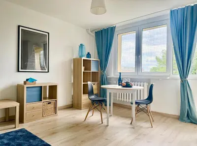 Część wypoczynkowa w obiekcie Cozy Apartment PGE Stadium