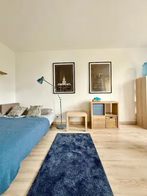 Łóżko lub łóżka w pokoju w obiekcie Cozy Apartment PGE Stadium
