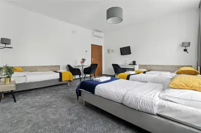 Łóżko lub łóżka w pokoju w obiekcie Nest Guest Rooms by Solarento