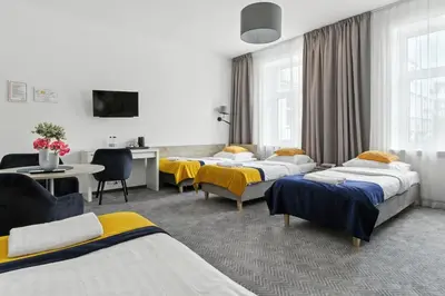 Łóżko lub łóżka w pokoju w obiekcie Nest Guest Rooms by Solarento