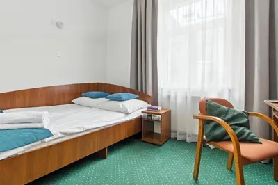 Łóżko lub łóżka w pokoju w obiekcie Nest Guest Rooms by Solarento