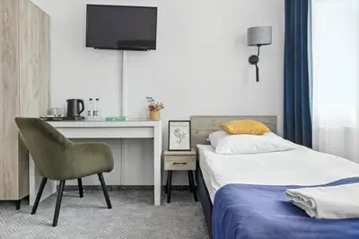 Łóżko lub łóżka w pokoju w obiekcie Nest Guest Rooms by Solarento