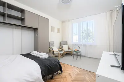 Łóżko lub łóżka w pokoju w obiekcie P&O Apartments Bonifraterska