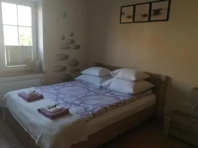 Łóżko lub łóżka w pokoju w obiekcie Villa Jeziorki