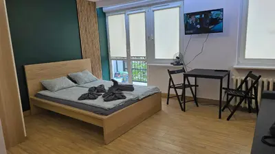 Łóżko lub łóżka w pokoju w obiekcie Apartament Kasia