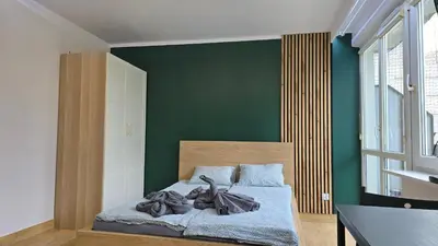 Łóżko lub łóżka w pokoju w obiekcie Apartament Kasia