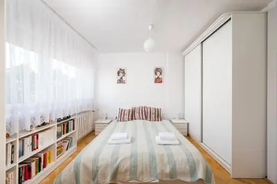 Łóżko lub łóżka w pokoju w obiekcie Ogrodowa City Comfort Apartment by Bookinghost