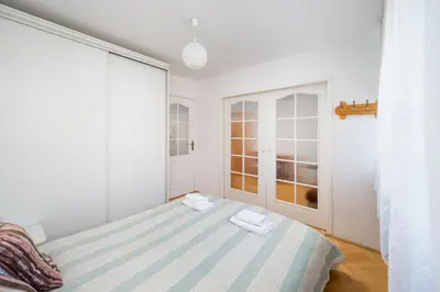 Łóżko lub łóżka w pokoju w obiekcie Ogrodowa City Comfort Apartment by Bookinghost
