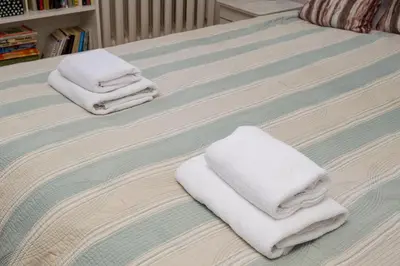 Łóżko lub łóżka w pokoju w obiekcie Ogrodowa City Comfort Apartment by Bookinghost