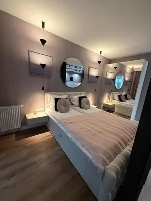 Łóżko lub łóżka w pokoju w obiekcie Energy Apart Okrzei Praga Północ