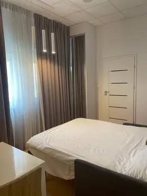 Łóżko lub łóżka w pokoju w obiekcie Aparthotel warsaw