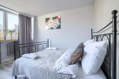 Łóżko lub łóżka w pokoju w obiekcie Komfortowy apartament w pobliżu Starego Miasta