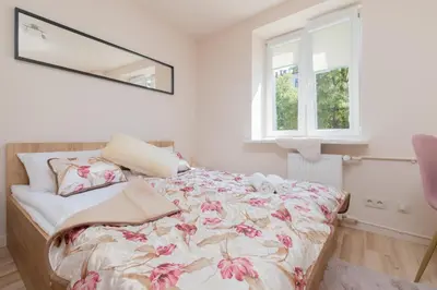 Łóżko lub łóżka w pokoju w obiekcie Mokotow Apartments Reytan by Noclegi Renters