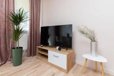 Telewizja i/lub zestaw kina domowego w obiekcie Mokotow Apartments Reytan by Noclegi Renters
