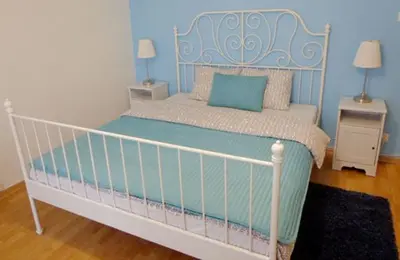 Łóżko lub łóżka w pokoju w obiekcie Rental Apartments Warecka